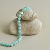 Light green jade bead necklace with 8mm natural jade gemstones, freshwater pearl centerpiece, and gold clasp – elegant Mediterranean-inspired gemstone jewelry for women.
