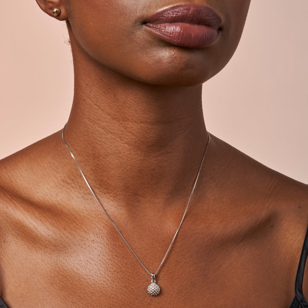 woman wearing Baja Silver Pendant by Ixora Jewelers